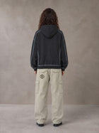 Model wearing the SM Eternal Fleur Cargo Trousers in Stone Grey, rear view.