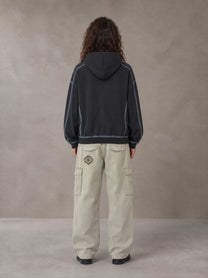 Model wearing the SM Eternal Fleur Cargo Trousers in Stone Grey, rear view.