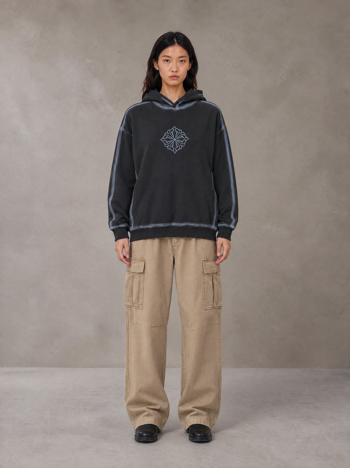 Model wearing the SM Eternal Fleur Cargo Trousers in Camel Tan, front view.