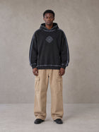 Model wearing the SM Eternal Fleur Cargo Trousers in Camel Tan, front view.