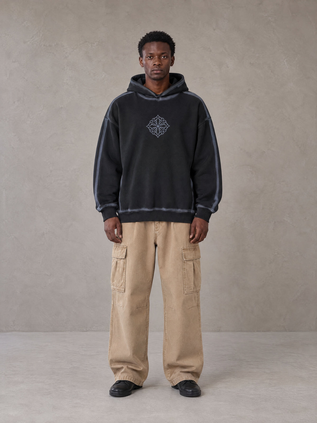 Model wearing the SM Eternal Fleur Cargo Trousers in Camel Tan, front view.
