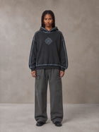 Model wearing the SM Eternal Fleur Cargo Trousers in Deep Charcoal, front view.