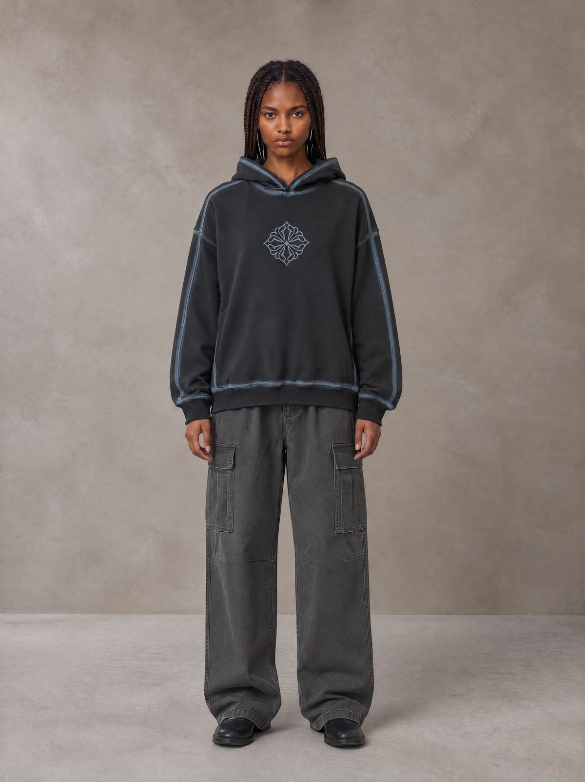 Model wearing the SM Eternal Fleur Cargo Trousers in Deep Charcoal, front view.