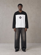 Model wearing the SM Eternal Fleur Forme T-shirt in Midnight Black, front view.