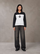 Model wearing the SM Eternal Fleur Forme T-shirt in Midnight Black, front view.