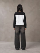 Model wearing the SM Eternal Fleur Forme T-shirt in Midnight Black, rear view.