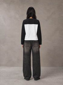 Model wearing the SM Eternal Fleur Forme T-shirt in Midnight Black, rear view.