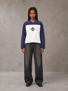 Model wearing the SM Eternal Fleur Forme T-shirt in Deep Purple, front view.