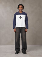 Model wearing the SM Eternal Fleur Forme T-shirt in Deep Purple, front view.
