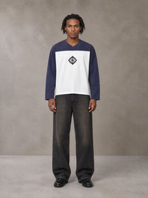 Model wearing the SM Eternal Fleur Forme T-shirt in Deep Purple, front view.