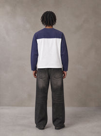 Model wearing the SM Eternal Fleur Forme T-shirt in Deep Purple, rear view.