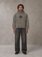 Model wearing the SM Eternal Fleur Hoodie in Stone Grey, front view.