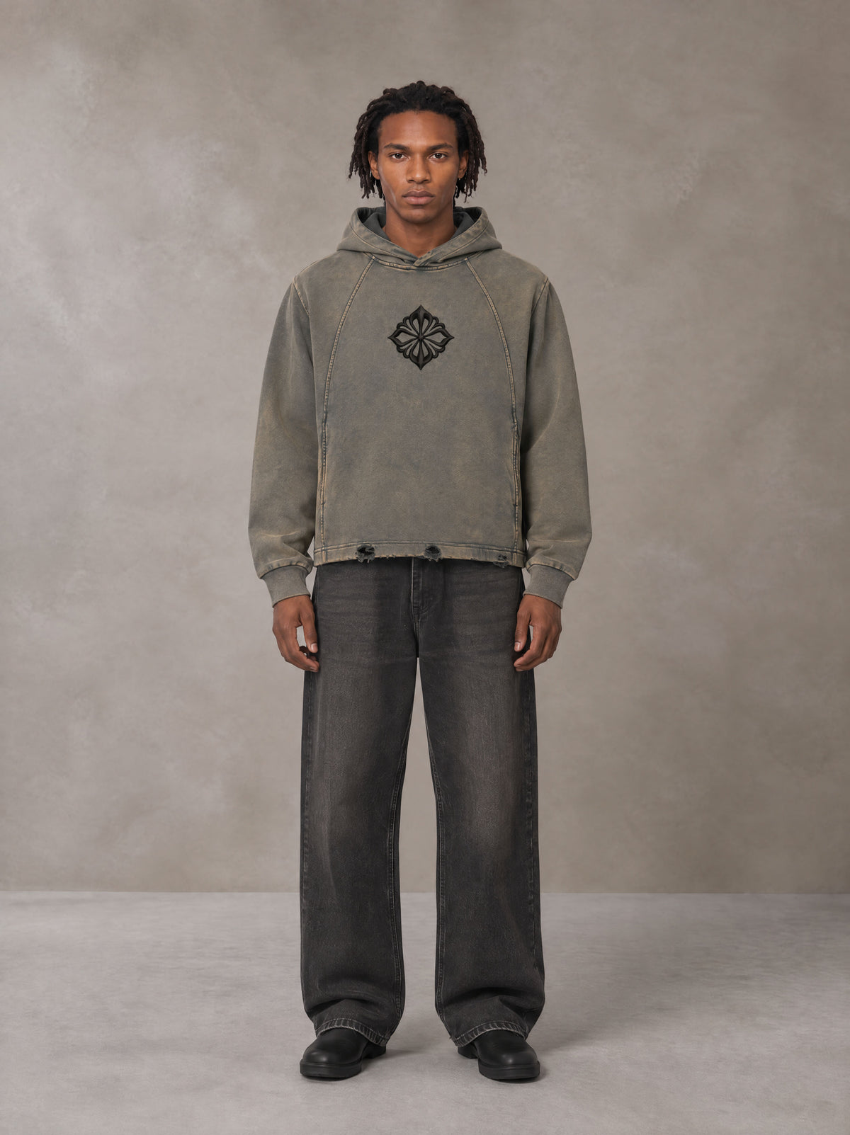 Model wearing the SM Eternal Fleur Hoodie in Stone Grey, front view.