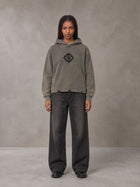 Model wearing the SM Eternal Fleur Hoodie in Stone Grey, front view.