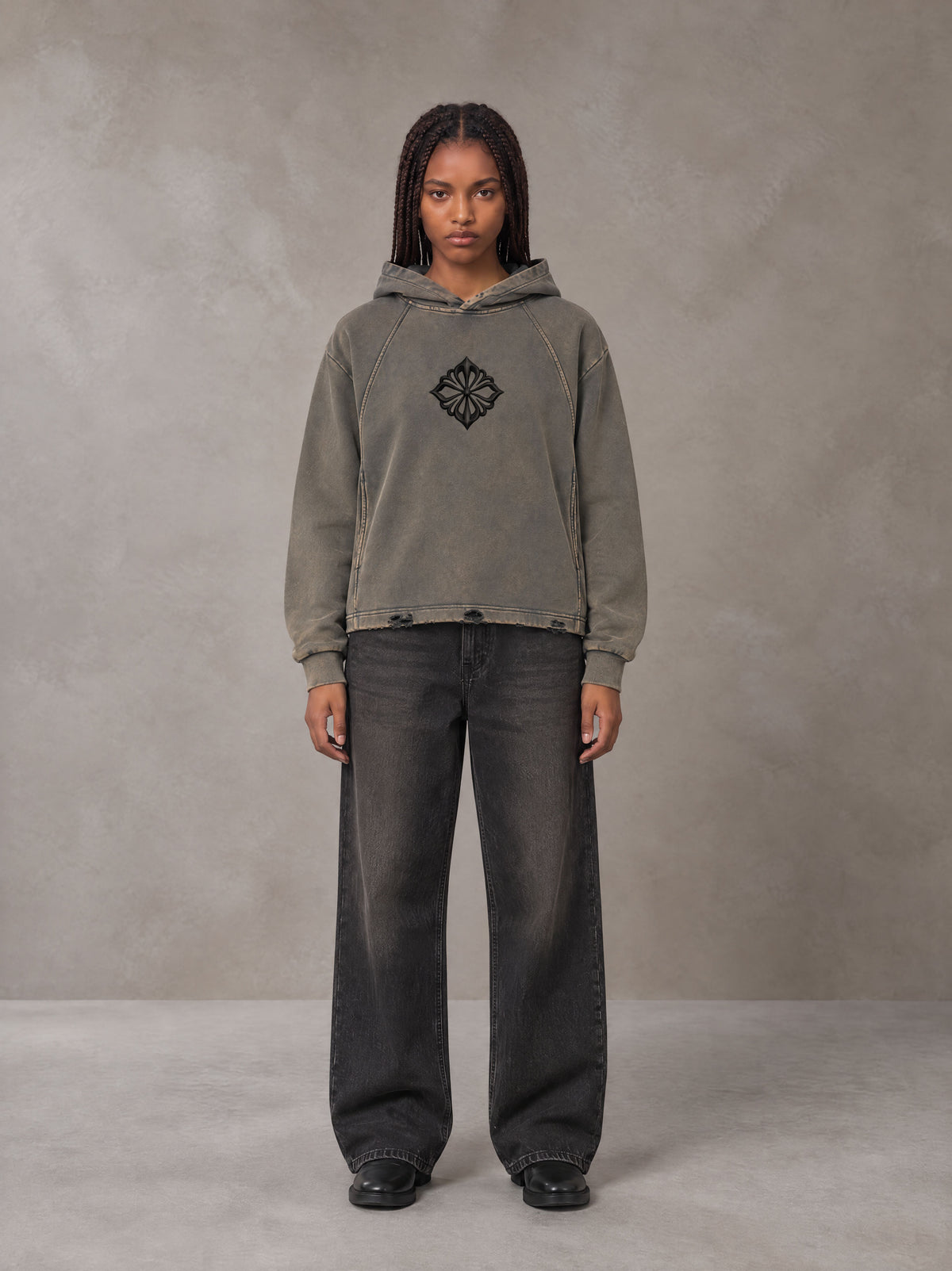 Model wearing the SM Eternal Fleur Hoodie in Stone Grey, front view.