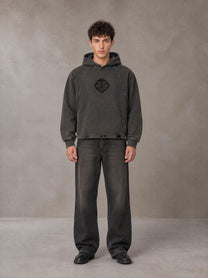 Model wearing the SM Eternal Fleur Hoodie in Deep Charcoal, front view.