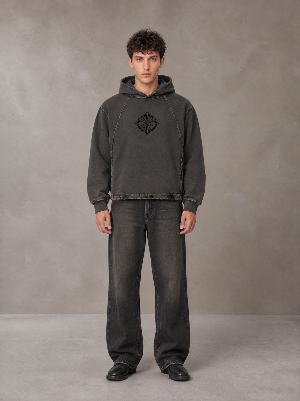 Model wearing the SM Eternal Fleur Hoodie in Deep Charcoal, front view.