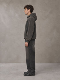 Model wearing the SM Eternal Fleur Hoodie in Deep Charcoal, side profile.
