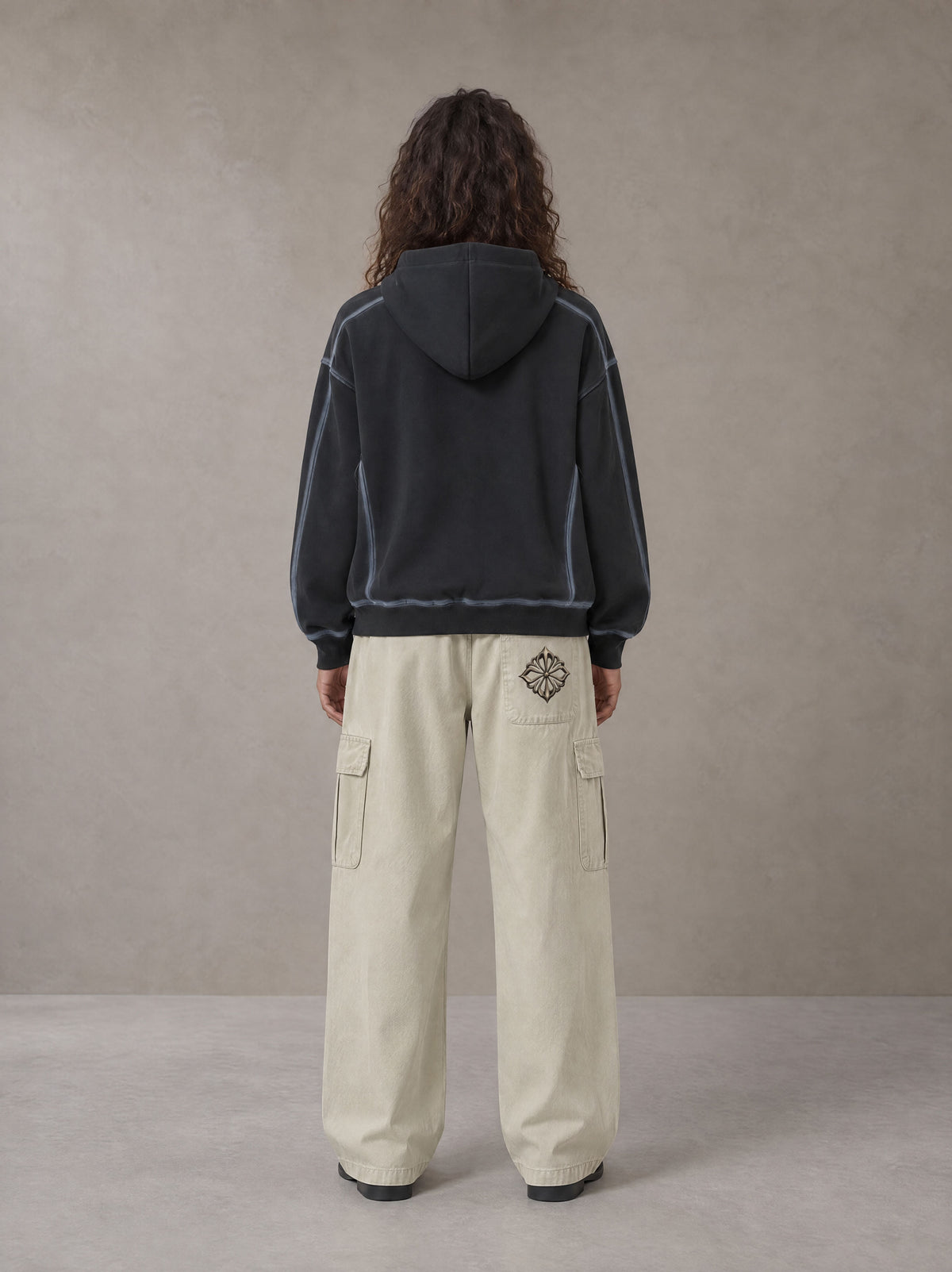 Model wearing the SM Eternal Fleur Straight Leg Cargo Pants in Oat Grey, rear view.