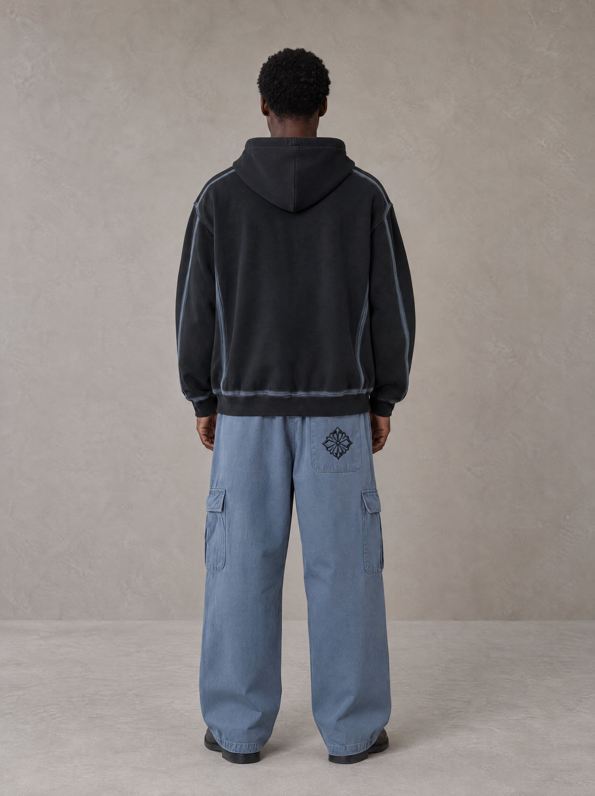Model wearing the SM Eternal Fleur Straight Leg Cargo Pants in Slate Blue, rear view.