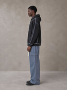 Model wearing the SM Eternal Fleur Straight Leg Cargo Pants in Slate Blue, side profile.