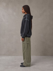 Model wearing the SM Eternal Fleur Straight Leg Cargo Pants in Heritage Khaki, side profile.