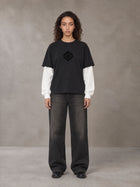 Model wearing the SM Eternal Fleur T-shirt in Midnight Black, front view.
