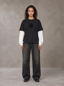 Model wearing the SM Eternal Fleur T-shirt in Midnight Black, front view.