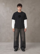 Model wearing the SM Eternal Fleur T-shirt in Midnight Black, front view.