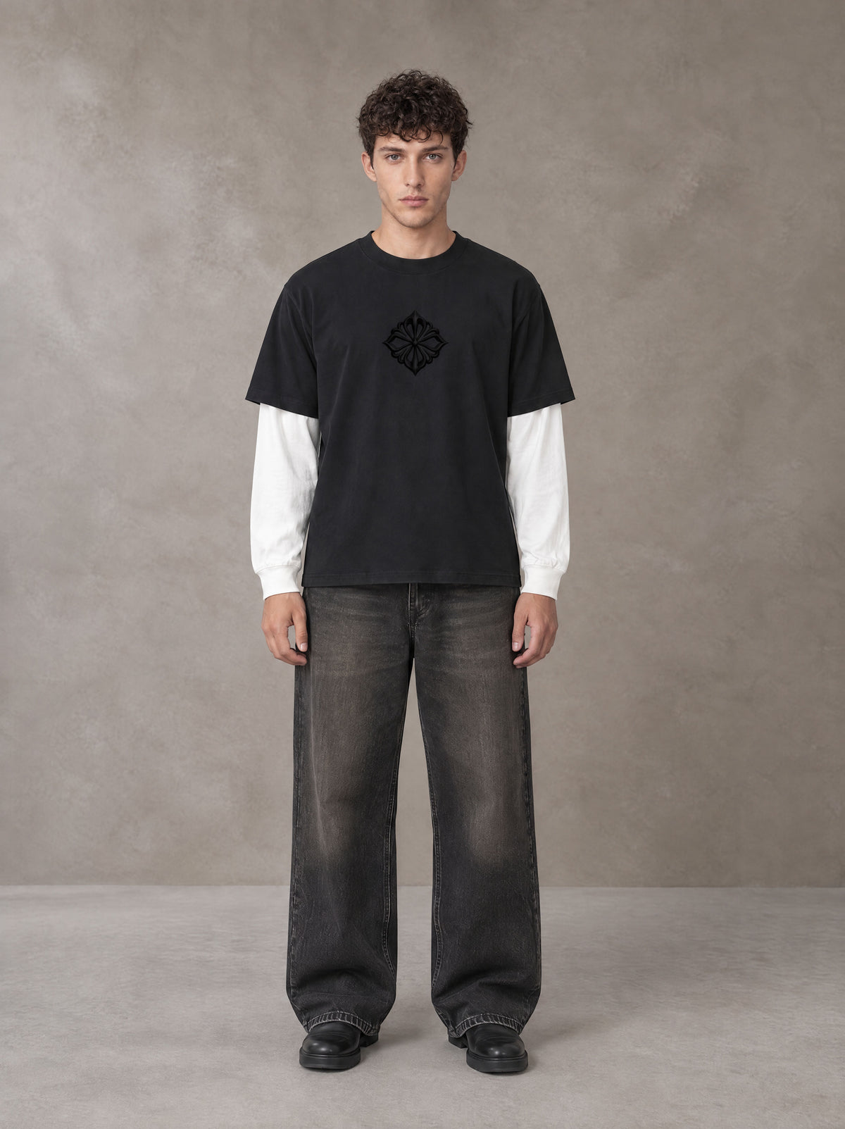 Model wearing the SM Eternal Fleur T-shirt in Midnight Black, front view.