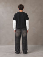 Model wearing the SM Eternal Fleur T-shirt in Midnight Black, rear view.
