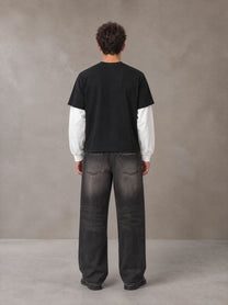 Model wearing the SM Eternal Fleur T-shirt in Midnight Black, rear view.