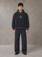 Model wearing the SM Heritage Straight Leg Denim Jeans in Ebony Clay, front view.