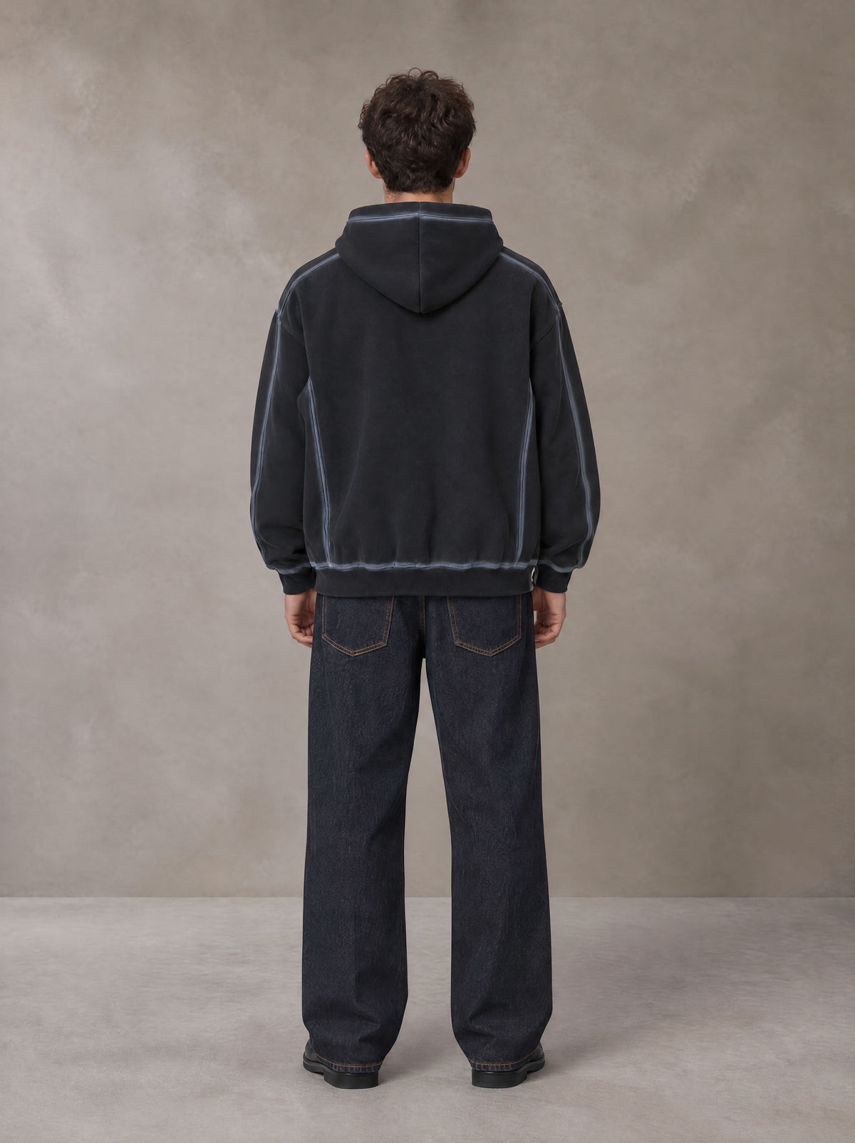 Model wearing the SM Heritage Straight Leg Denim Jeans in Ebony Clay, rear view.