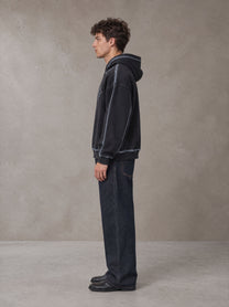 Model wearing the SM Heritage Straight Leg Denim Jeans in Ebony Clay, side profile.