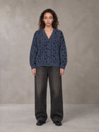 Model wearing the SM Abstract Jacquard Knitted Cardigan in Oxford Navy, front view.