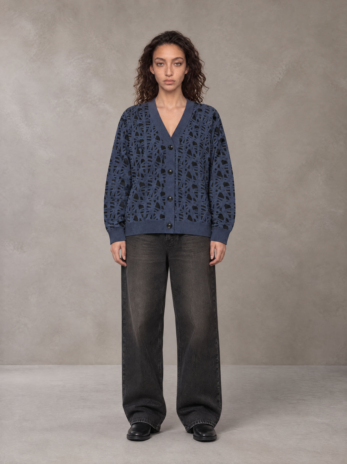 Model wearing the SM Abstract Jacquard Knitted Cardigan in Oxford Navy, front view.