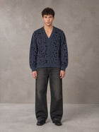 Model wearing the SM Abstract Jacquard Knitted Cardigan in Oxford Navy, front view.