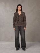 Model wearing the SM Abstract Jacquard Knitted Cardigan in Kabul Brown, front view.