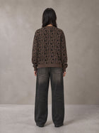 Model wearing the SM Abstract Jacquard Knitted Cardigan in Kabul Brown, rear view.
