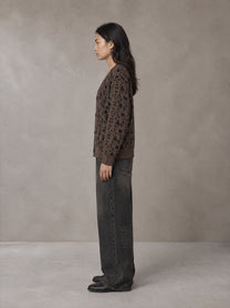 Model wearing the SM Abstract Jacquard Knitted Cardigan in Kabul Brown, side profile.