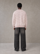 Model wearing the SM Abstract Jacquard Knitted Cardigan in Muted Pink, rear view.