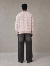 Model wearing the SM Abstract Jacquard Knitted Cardigan in Muted Pink, rear view.