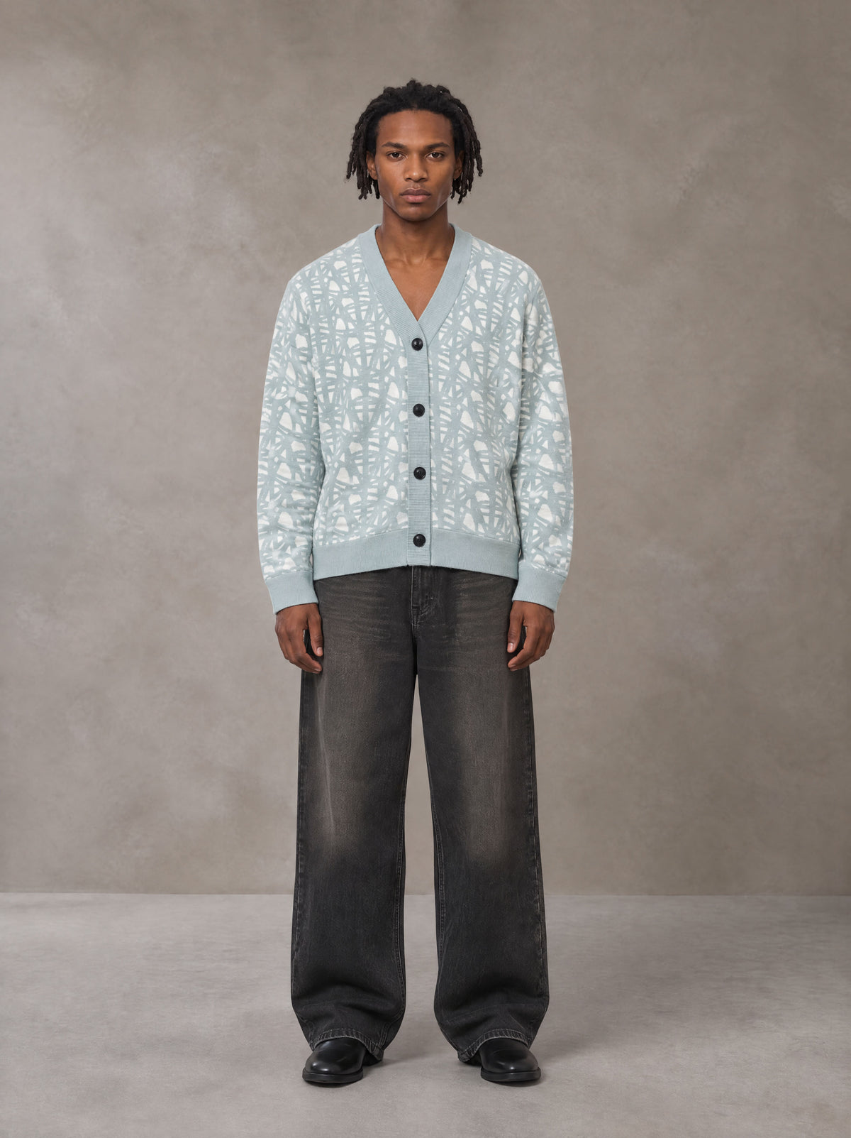 Model wearing the SM Abstract Jacquard Knitted Cardigan in Ice Blue, front view.