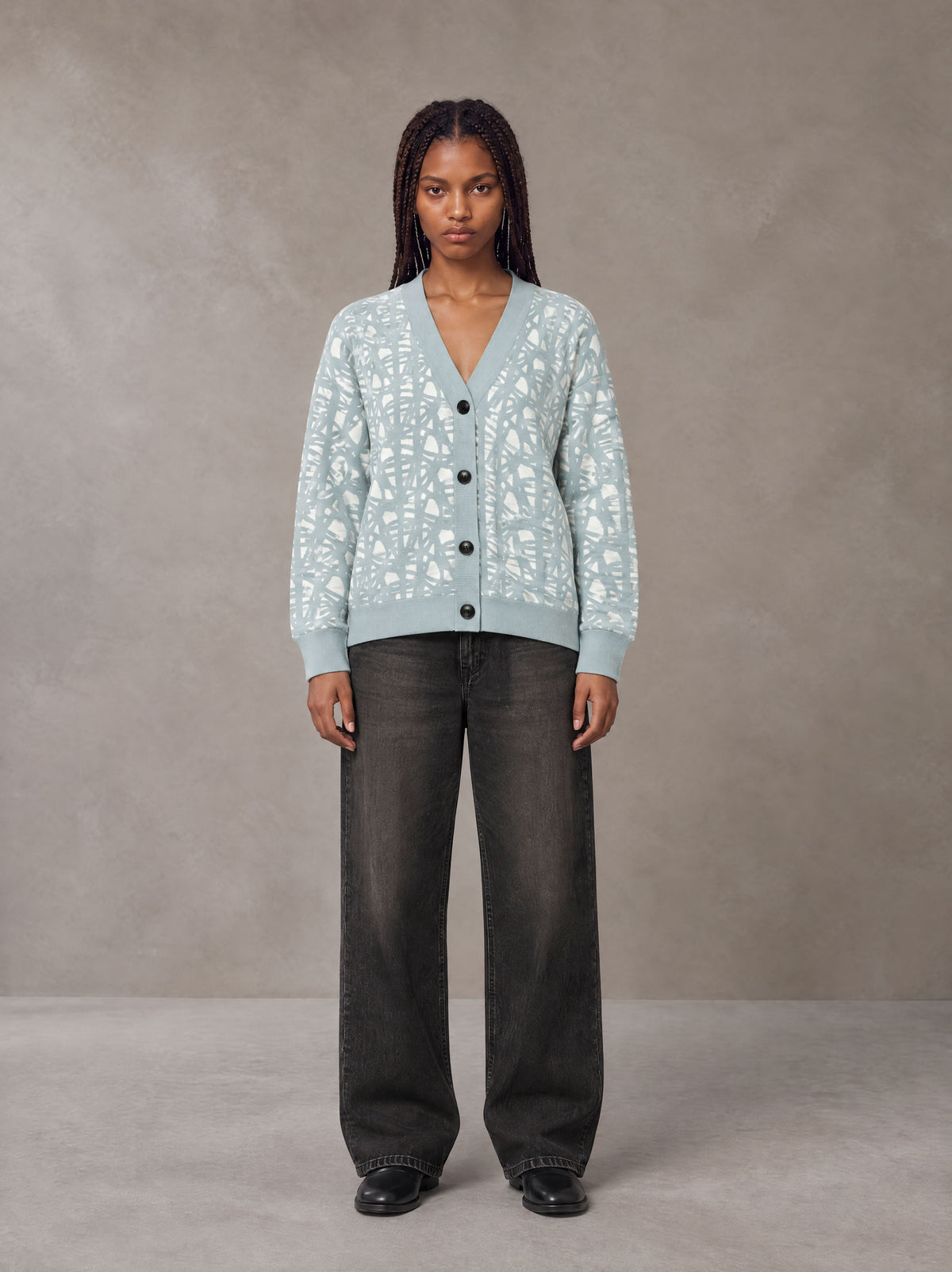 Model wearing the SM Abstract Jacquard Knitted Cardigan in Ice Blue, front view.