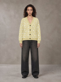 Model wearing the SM Abstract Jacquard Knitted Cardigan in Natural Flax, front view.