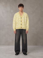 Model wearing the SM Abstract Jacquard Knitted Cardigan in Natural Flax, front view.