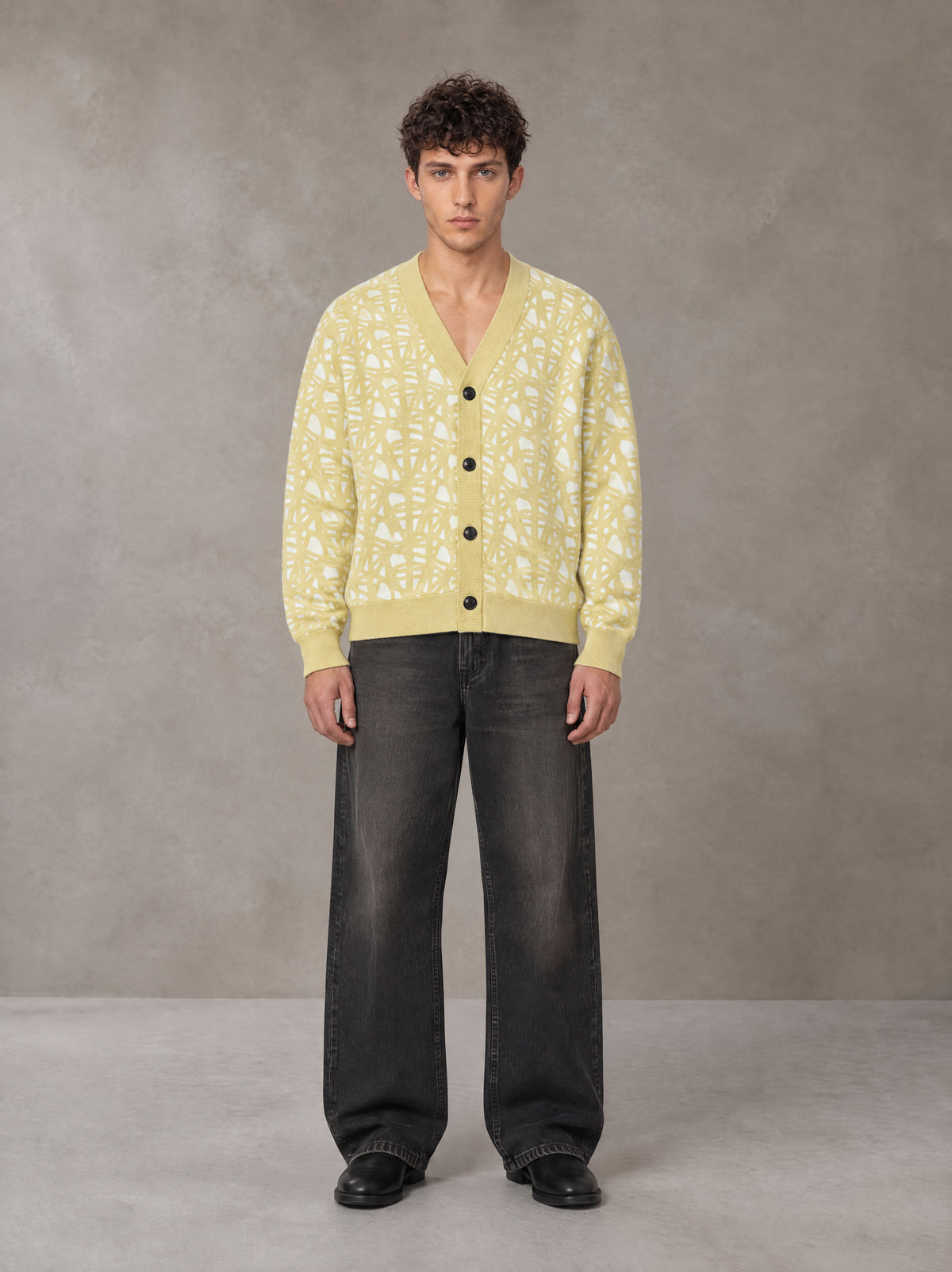 Model wearing the SM Abstract Jacquard Knitted Cardigan in Natural Flax, front view.