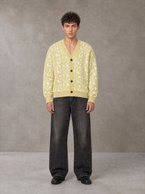 Model wearing the SM Abstract Jacquard Knitted Cardigan in Natural Flax, front view.