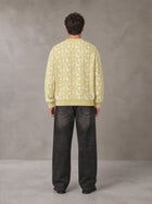 Model wearing the SM Abstract Jacquard Knitted Cardigan in Natural Flax, rear view.